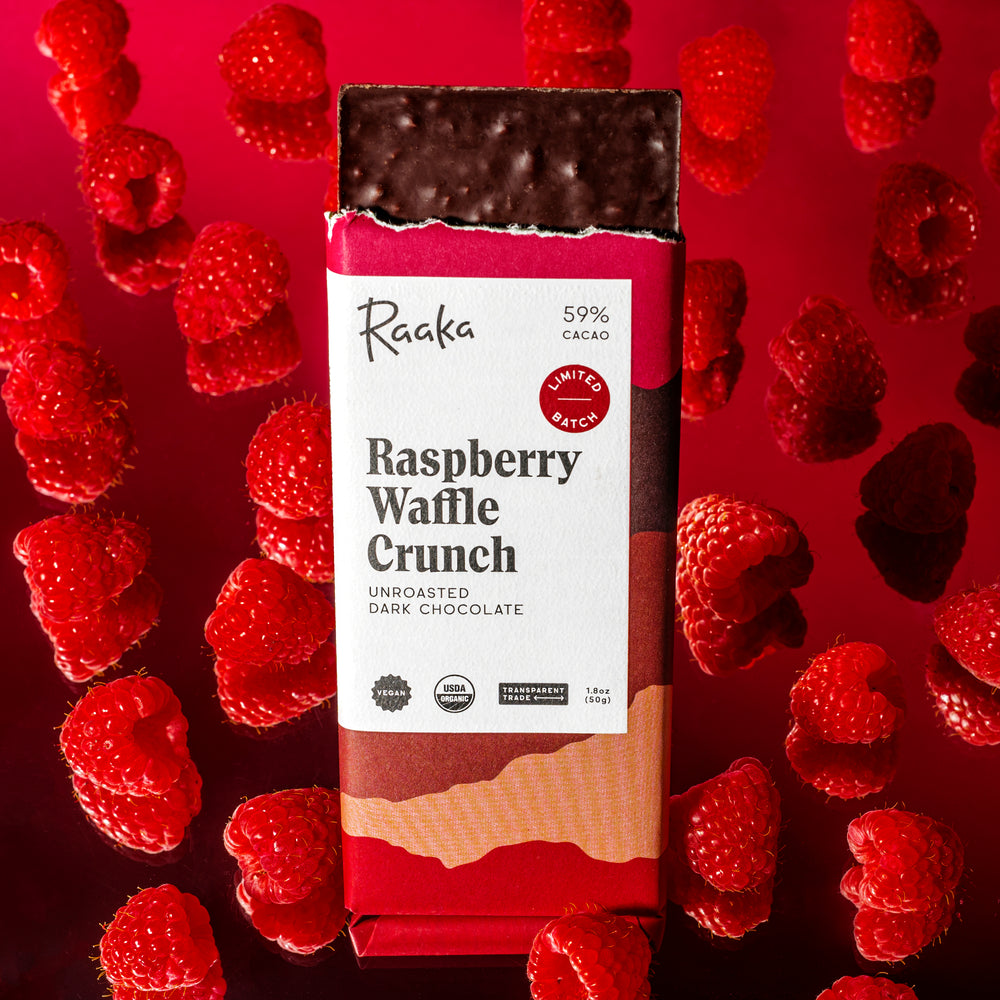 Raspberry Waffle Crunch Dark Chocolate Bar with fresh raspberries