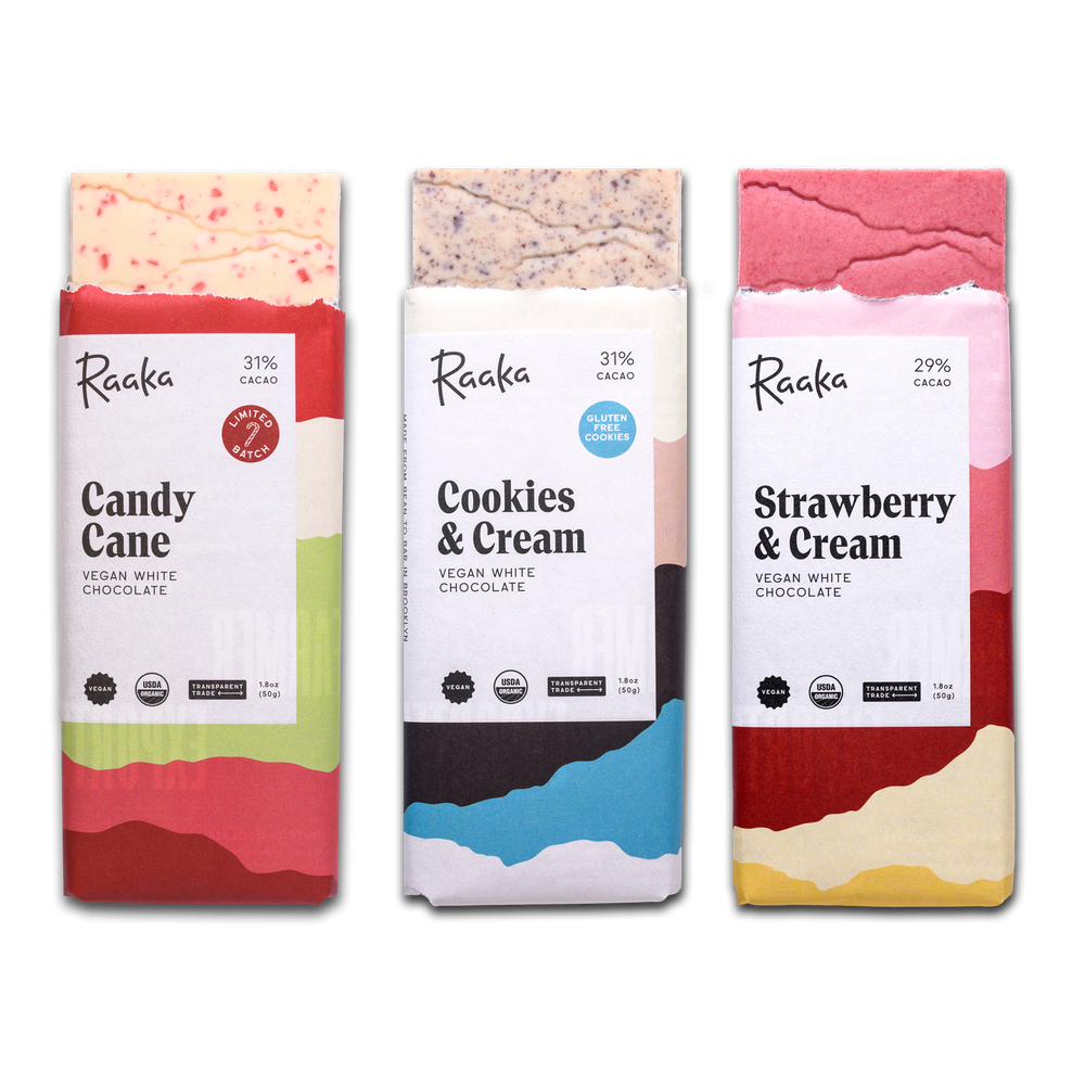 Three white chocolate bars: candy cane, cookies & cream, strawberry & cream