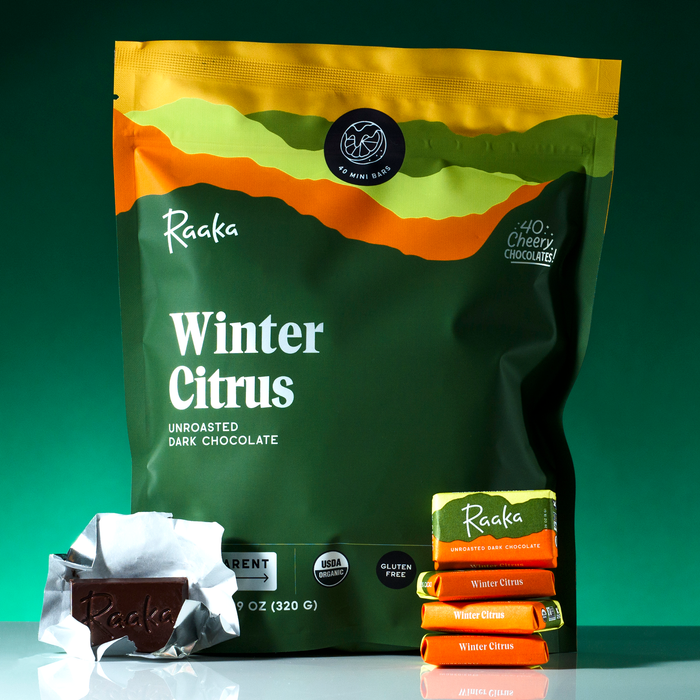 Raaka Chocolate Winter Citrus Bag with a stack of minis