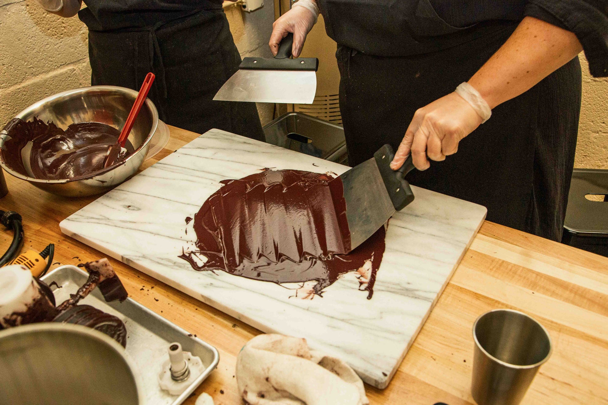 Tempering chocolate on a marble slab